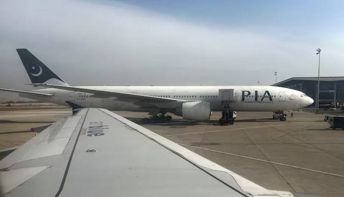 Pakistan International Airlines (PIA) passenger plane sits on tarmac, as seen through a plane window, at the Islamabad International Airport, Islamabad, Pakistan October 27, 2024. — Reuters