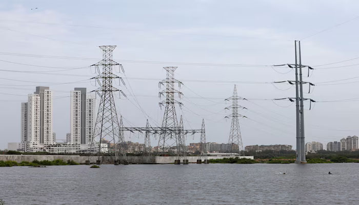 Power transmission towers are pictured in Karachi, Pakistan July 26, 2022. — Reuters