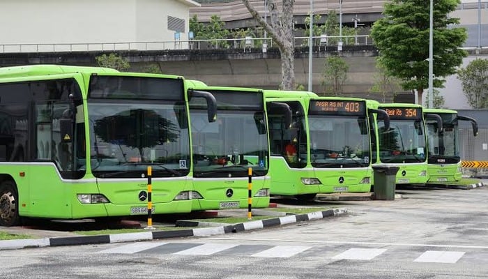 An undated image of green buses. — Unsplash