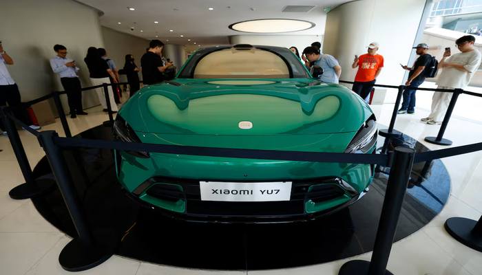 People look at the new electric SUV YU7 displayed at a Xiaomi store in Beijing, China May 29, 2025. — Reuters
