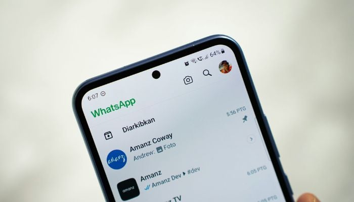 An undated image of a person using WhatsApp. — Unsplash