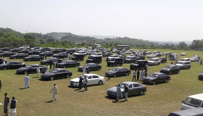 People visit an auction of government owned used cars at the premises of Prime Minister House in Islamabad, Pakistan September 17, 2018. — Reuters