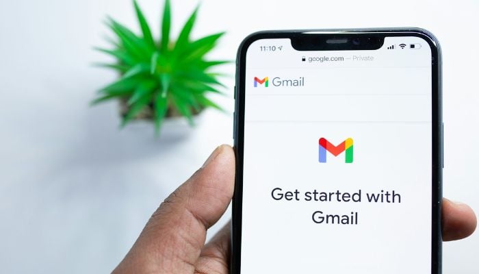 An undated image of a person using Gmail app on phone. — Unsplash