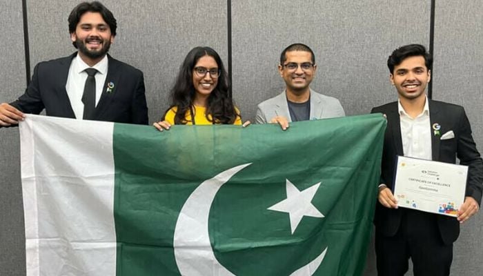 (From left) IST’s Ahmed Iqbal, Google’s Amrita Nambiar, Saad Hamid, and IST’s Abdullah Asif pose with Pakistan’s flag after winning ‘Best AI Use Case’ at the APAC Solution Challenge in Manila on June 26, 2025. — Institute of Space Technology website