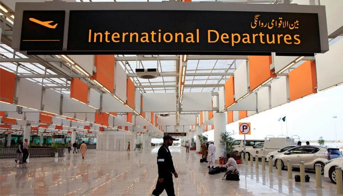 A worker walks at the departure area of the newly built Islamabad International Airport, during a media tour ahead of its official opening, Pakistan April 18, 2018. — Reuters