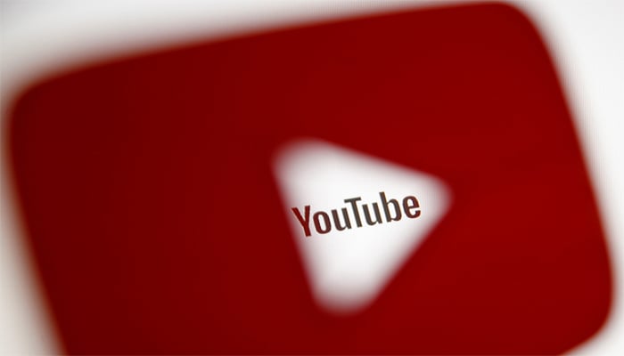 A 3D-printed YouTube icon is seen in front of a displayed YouTube logo in this illustration taken October 25, 2017. — Reuters