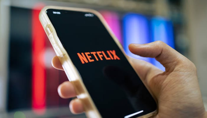 An undated image showing Netflix logo on smartphone. — iStock