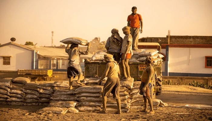An undated image of labours working on a site. — Shutterstock