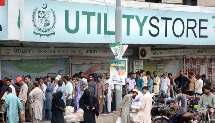 A long queue of people is seen outside a utility store in an undated picture. — APP