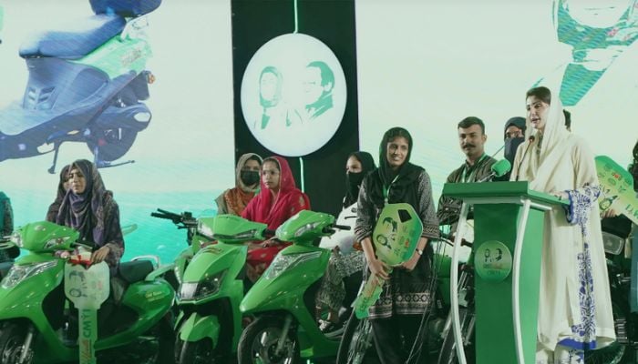 An undated image of Maryam distributing Electric Bikes to girls. — Punjab Bikes