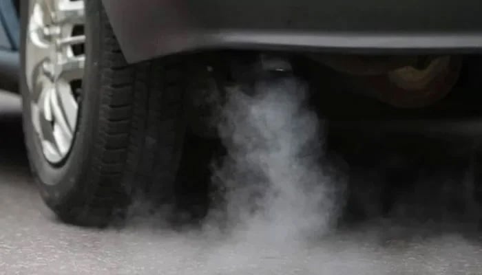 An undated image of a vehicle emitting smoke. — AFP