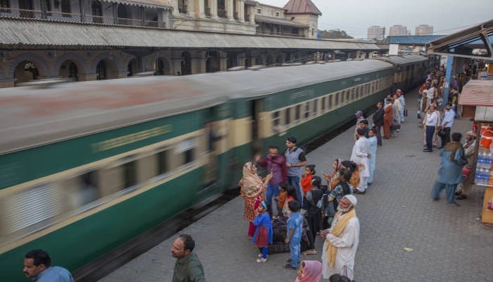 An undated image showing people and train at Karachi station. — Getty Images
