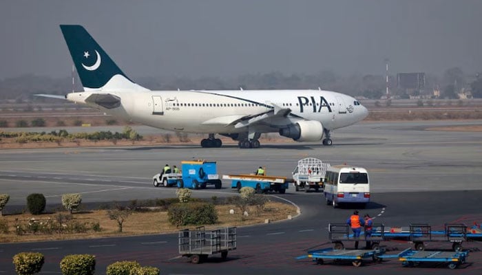 A Pakistan International Airlines (PIA) plane prepares to take-off at Allama Iqbal International Airport in Lahore. — Reuters