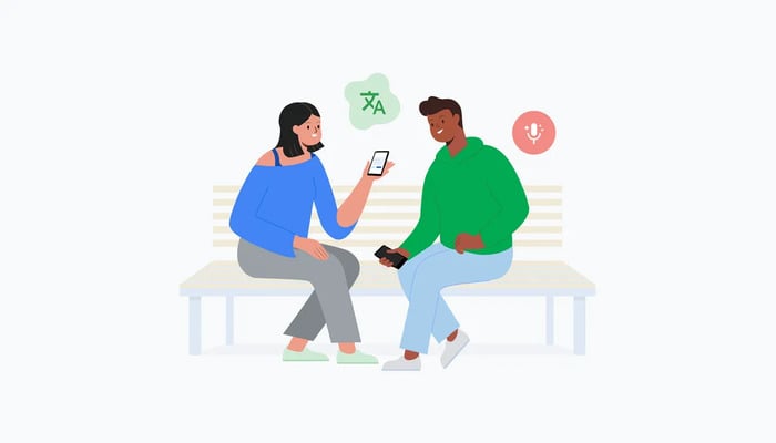 A representational image of two persons using Google Translates new feature. — Google Blog