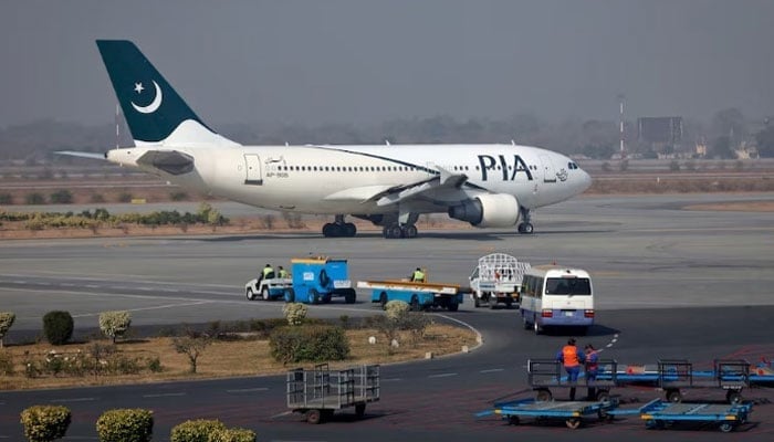 A Pakistan International Airlines (PIA) plane prepares to take-off at Allama Iqbal International Airport in Lahore. — Reuters