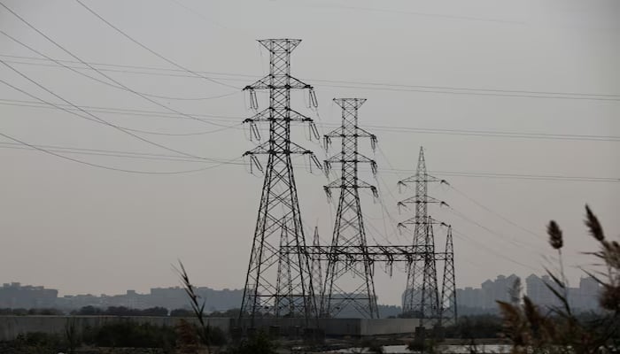 A power transmission tower is seen a day after a country-wide power breakdown, in Karachi, Pakistan, January 24, 2023. — Reuters