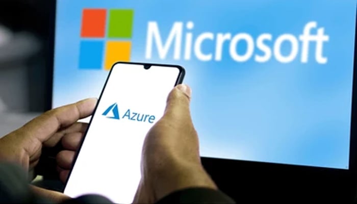 An undated image showing Azure on smartphone and Microsoft in background. — Shutterstock